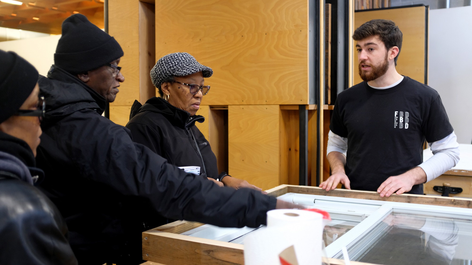 Pittsburgh residents learn about the contents of the Freedom by Design weatherization kits