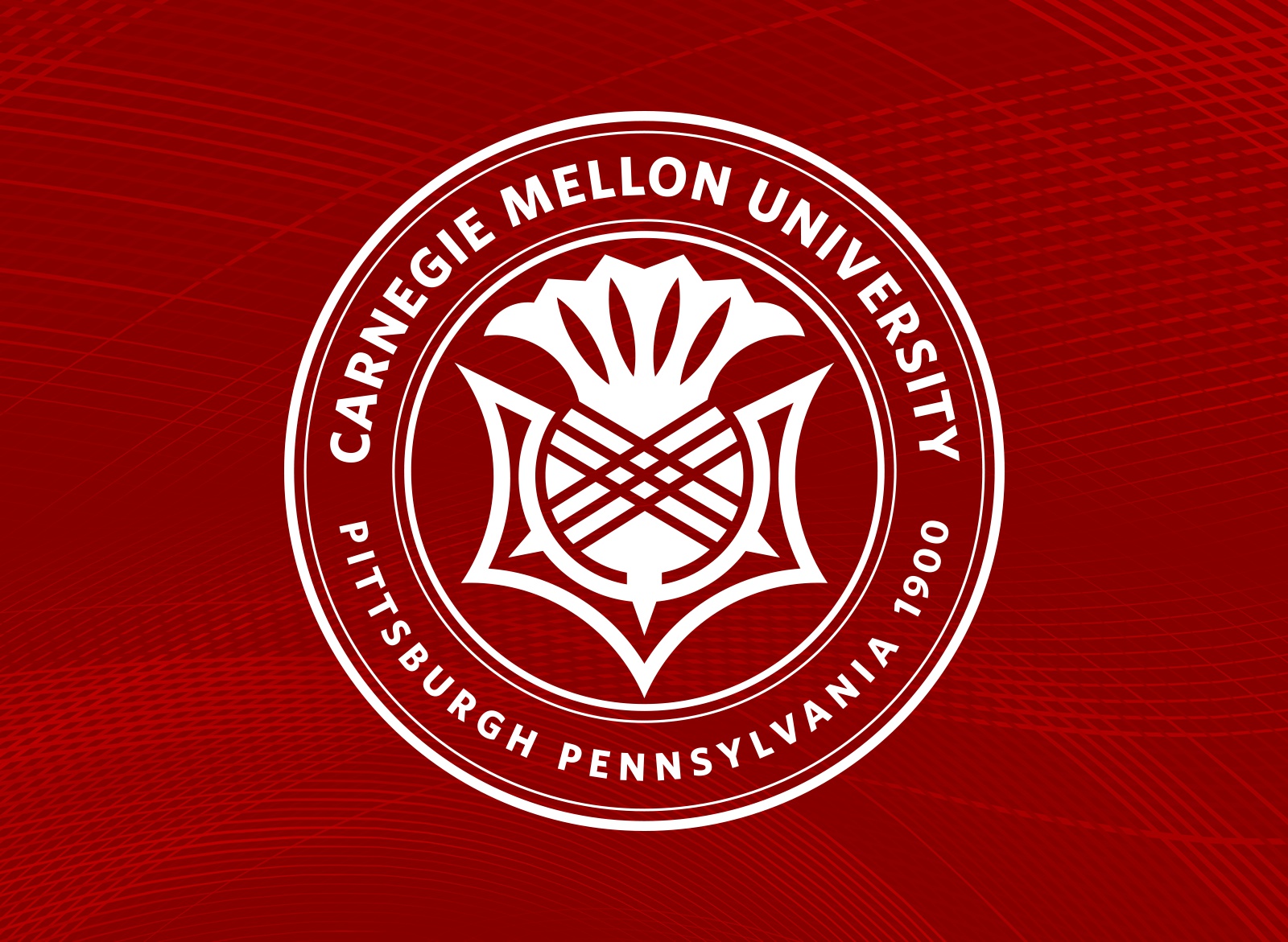 CMU seal on a red tartan background